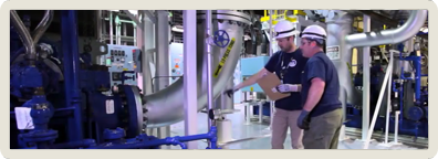 Photo: Energy Northwest Staff inspecting a pump